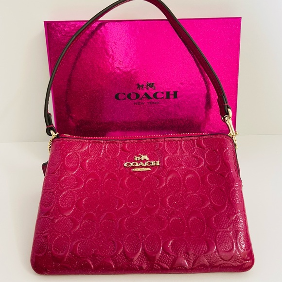Coach Handbags - PINK COACH SIGNATURE C- COACH WRISTLET-LIKE NEW-GORGEOUS AND SHINY.